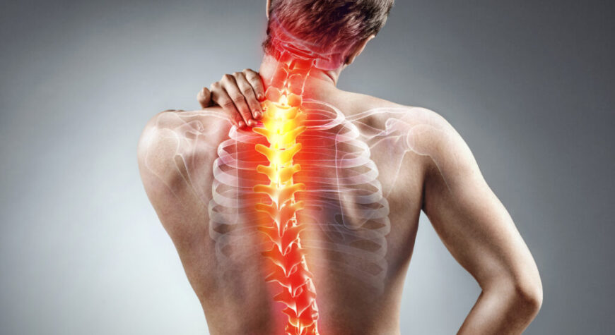 Scoliosis and Mental Health Support - Synchrony Chiropractic & Sports Physiotherapy - Chiropractor Near Me | Delhi | Noida | Chandigarh Physiotherapist helping scoliosis patient with emotional and physical care
